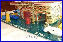 Antique toy automobile service center. Spectacular art work. Approx 1958-1960