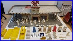 Vintage 1950s grey MARX Tin Service Center with accessories gas pumps figures lift